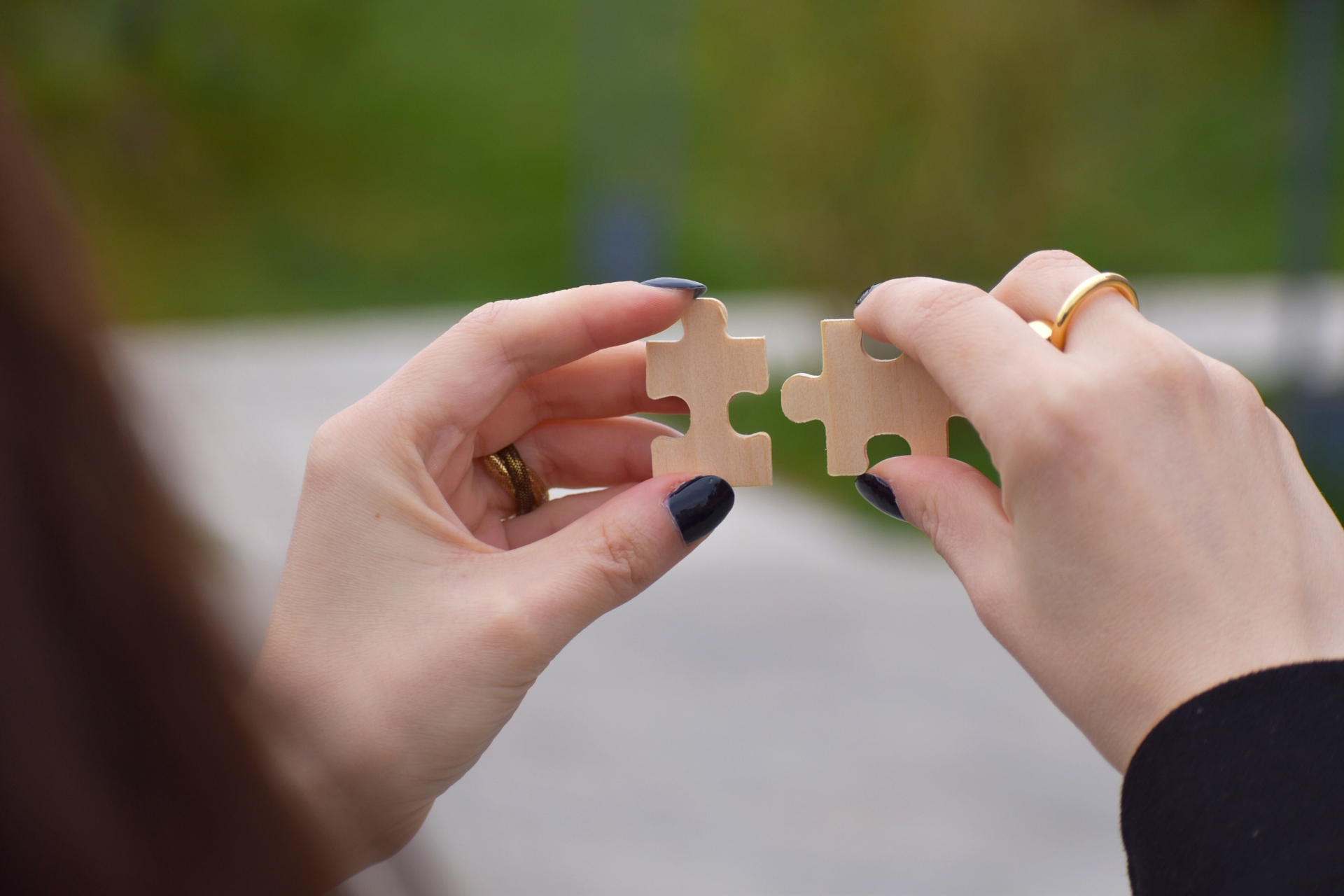 Hand holding puzzle pieces